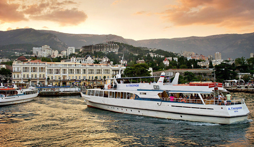 Pleasure cruisers and Yalta at sunset
